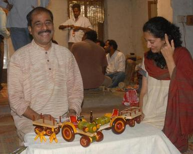 Presenting wooden toys to a visitor